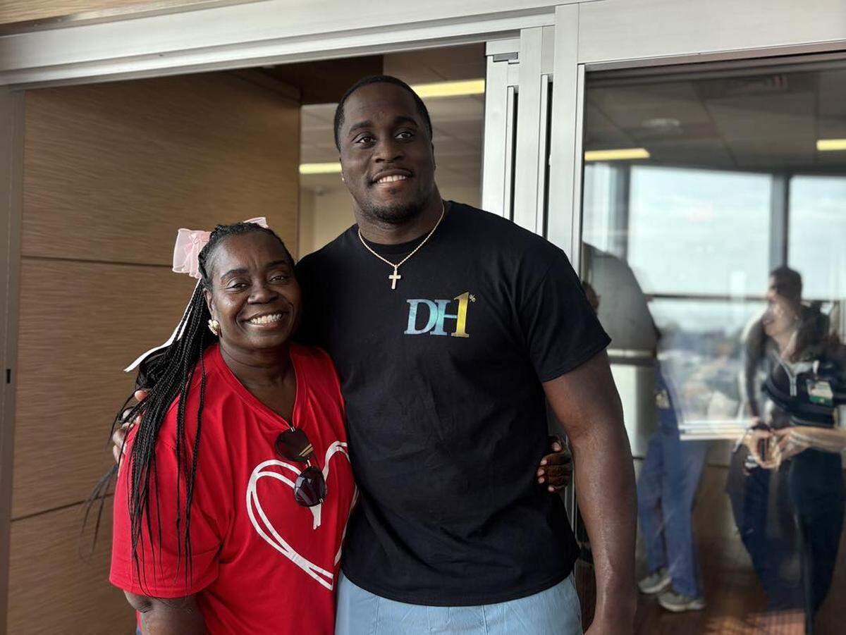 Seattle Seahawks linebacker Derick Hall and his mom, Stacy Gooden-Crandle pose for a photo outside the Neonatal Intensive Care Unit at Memorial Hospital Gulfport. Hall and his mom visited for Valentine’s Day 2025. They have always gone out of their way to acknowledge Memorial NICU’s for saving his life when he was born four months early and without a heartbeat.