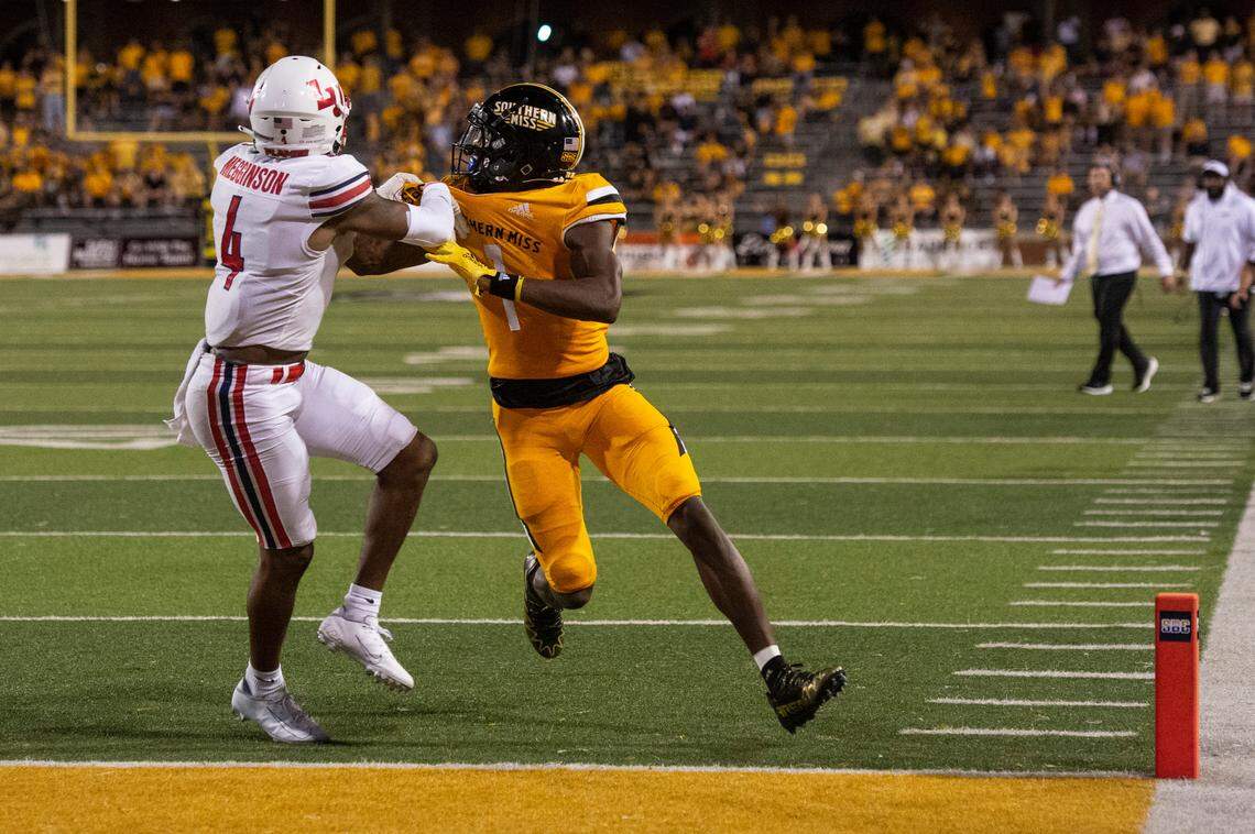 Southern Mississippi wide receiver Jason Brownlee (1) and Liberty cornerback Chris Megginson (4) fight for a pass during a NCAA college football game in Hattiesburg, Miss., Saturday, Sept. 3, 2022. Pass interference was called on Southern Miss.