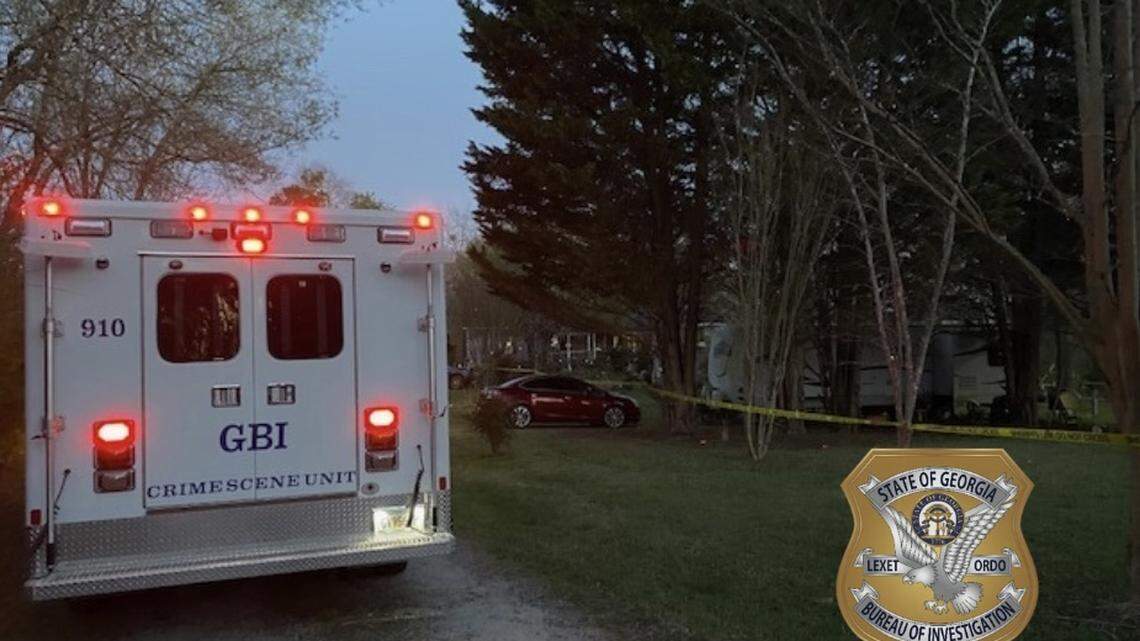 Deputies shot and killed a man accused of pointing and shooting a gun at his neighbor during a fight in Carroll County, according to the Georgia Bureau of Investigation.