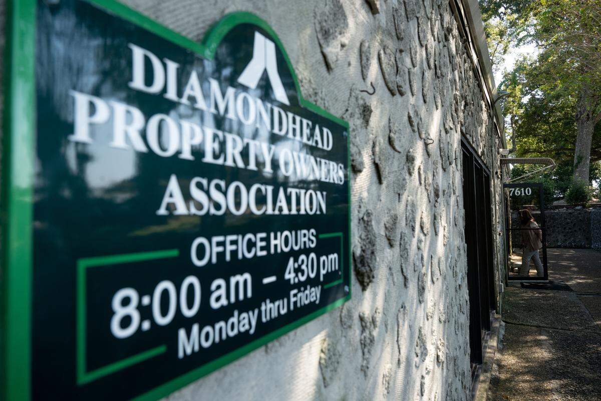 Residents walk into the office for the Diamondhead Property Owners Association on Tuesday, Oct. 14, 2025.
