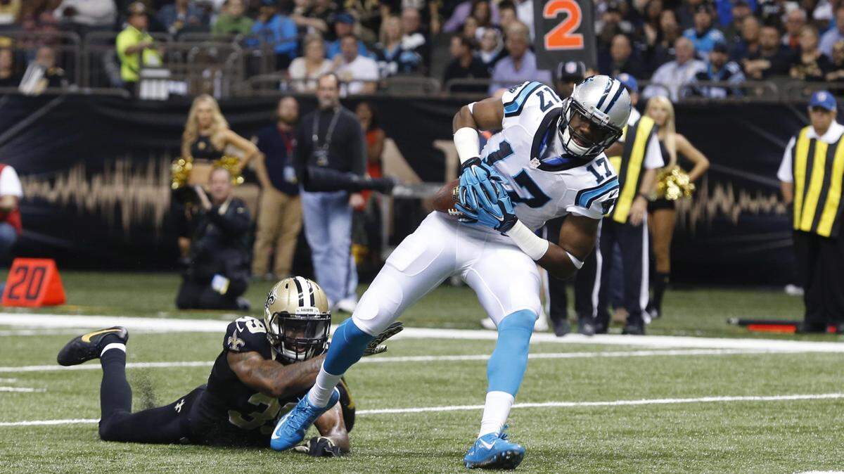 Carolina Panthers wide receiver Devin Funchess (17) scores a touchdown in front of New Orleans Saints cornerback Brandon Browner in the second half of an NFL football game in New Orleans, Sunday, Dec. 6, 2015. (AP Photo/Jonathan Bachman)