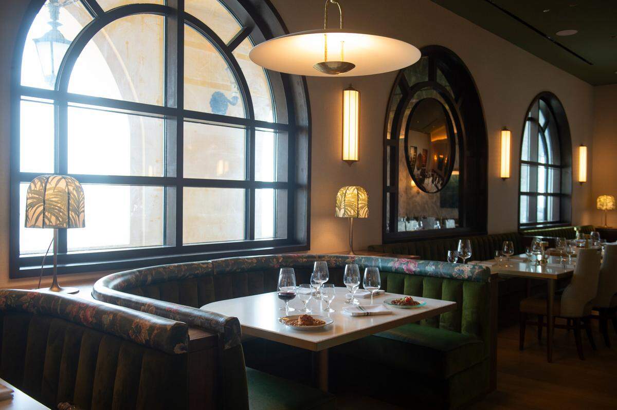 Arched windows inside Coraline’s new seafood restaurant at the Beau Rivage Resort and Casino in Biloxi match the arches on the exterior and give impressive views of the water looking out toward the Gulf.