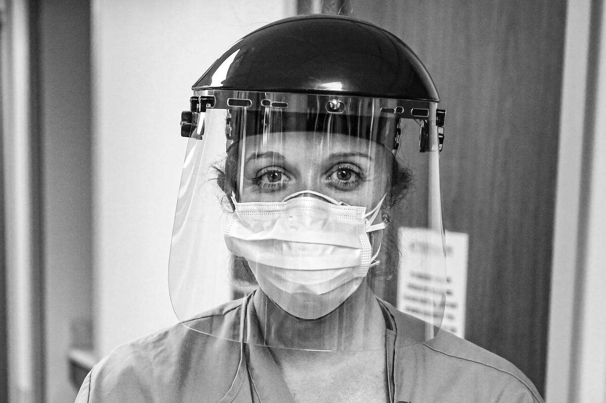 Nurse Robin McConnell dresses in full PPE on the COVID-19 floor at Singing River Hospital in Pascagoula to see a patient April 2, 2020.