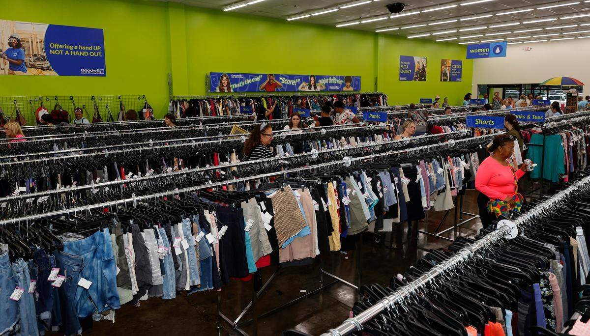 Signs posted at the former Goodwill inform the public the store has moved. Crews recently removed the storefront sign and cleared out leftover donations.