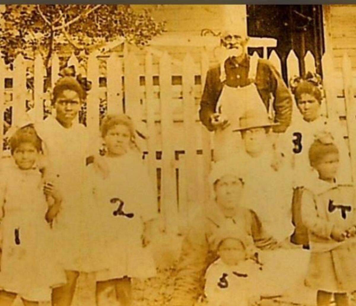 Henry Hyde, Melissa Evan’s fourth-generational great grandfather, was born around 1850. He spent most of his life living in Jackson County and working for a white family named the Dantzlers. Evans has not been able to find any information about Hyde’s parents, or even whether he was enslaved as a child prior to Emancipation. Hyde is pictured here in about 1908, wearing overalls, with his daughters and grandchildren, including Evans’s grandmother Edith Davidson Breland.
