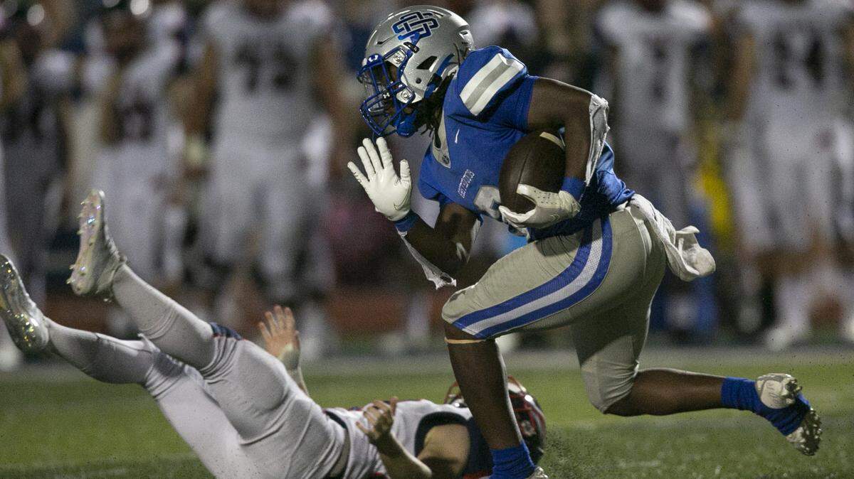Ocean Springs’ runningback David Humphries avoids getting tackled during the matchup between Ocean Springs and Hancock at Greyhound Stadium in Ocean Springs on Friday, Sept. 24, 2021.