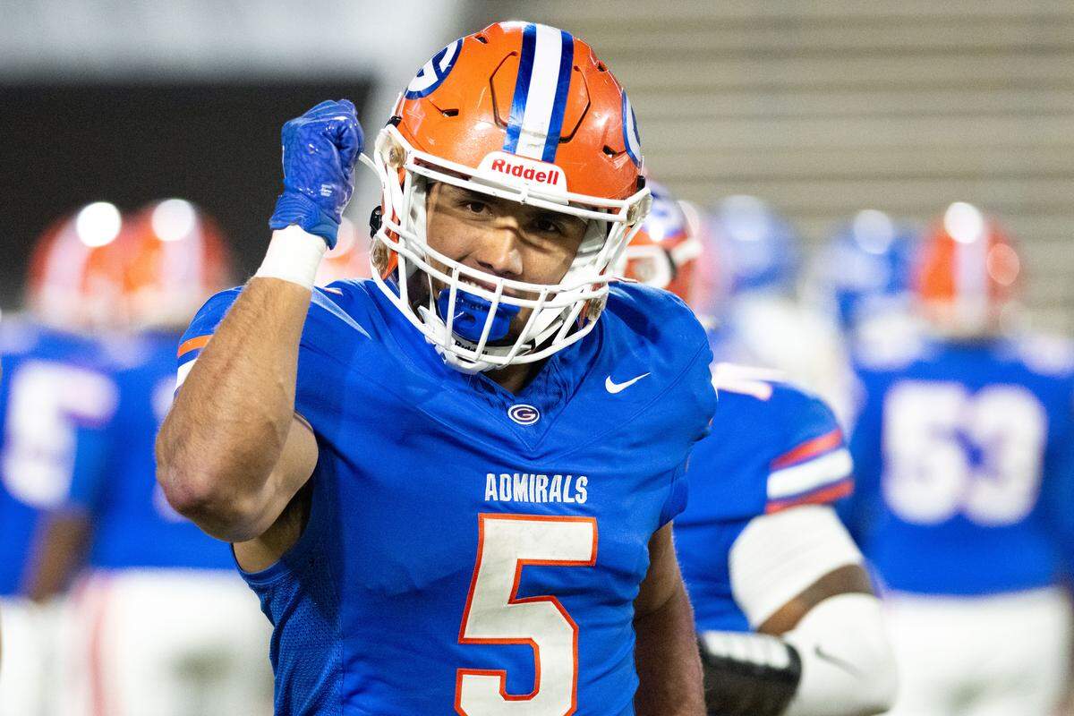 Gulfport running back Cooper Crosby (5) celebrates one of his two touchdown runs Saturday.