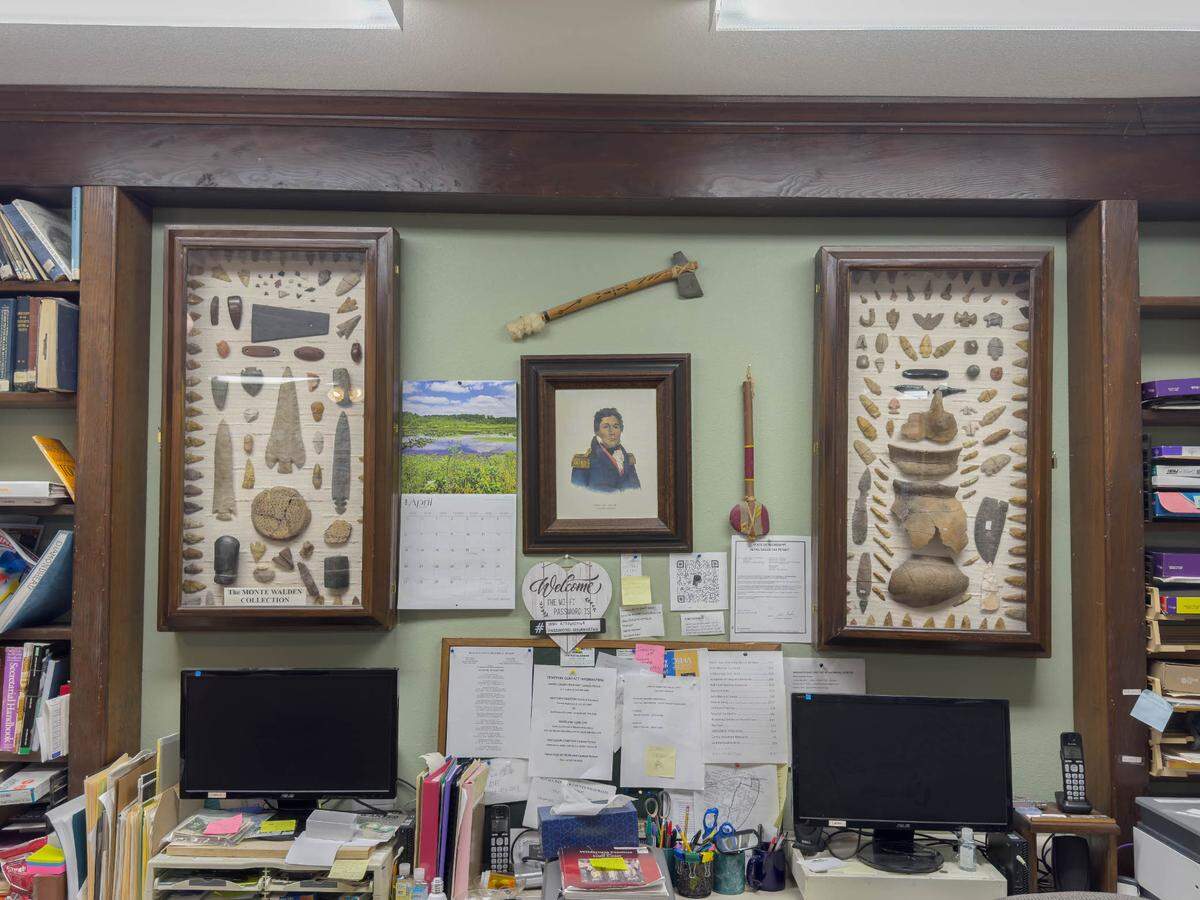 Framed arrowheads and hand tools line the wall of the Hancock County Historical Society and Museum. The center is run by volunteers and relies on dues, donations and grant funding to operate.