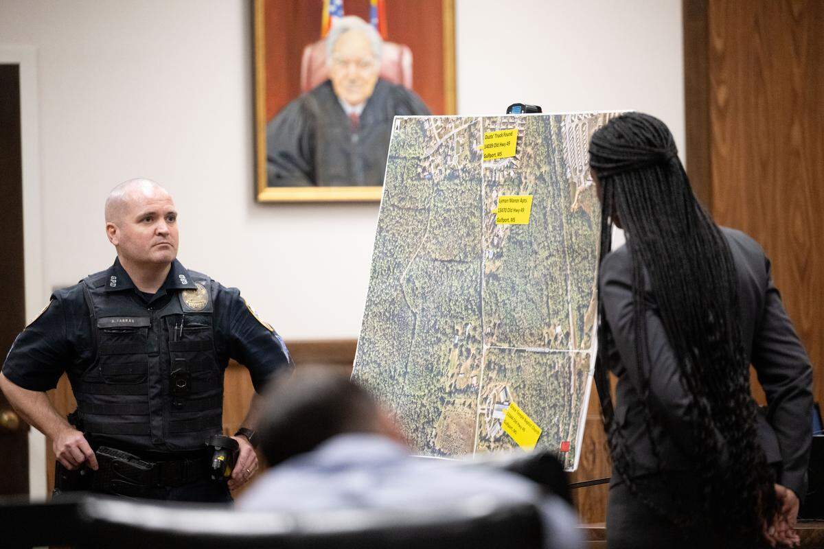 Bryan Farrar, left, presents a map showing where he found Michael Ouzts during a testimony hearing at Harrison County Circuit Court on Tuesday.