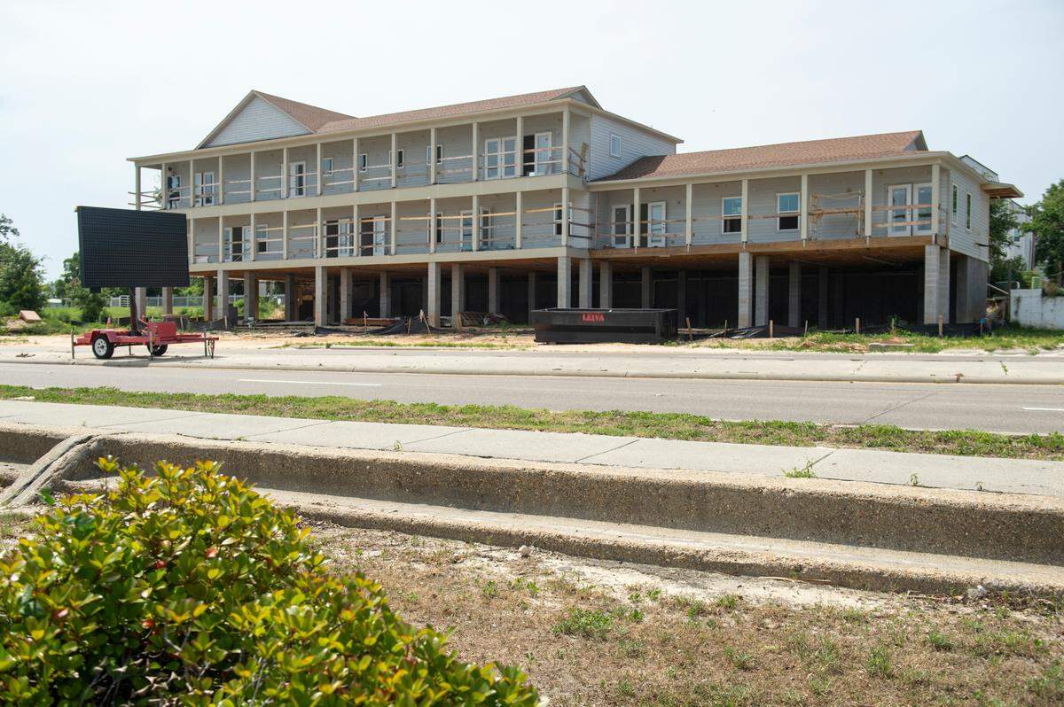 Work continues on The Beach House in Pass Christian in May. It is one of several resorts, apartments and other businesses under construction in and near the downtown of Pass Christian, now a Mississippi Main Street Community.