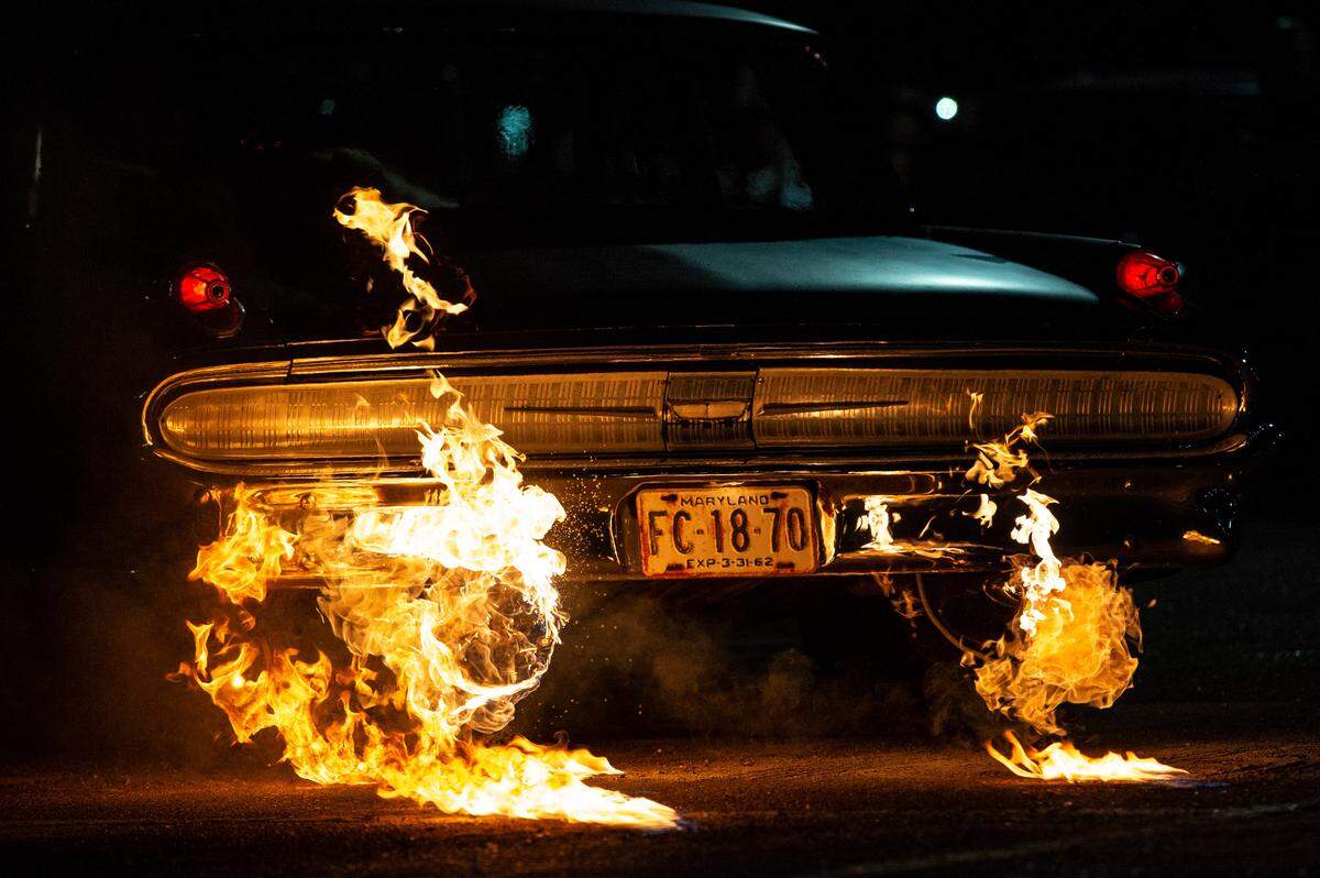 Jason Hamilton’s 1962 Mercury Monterey spews flames out of the tailpipes onto the ground during a flame throwing competition, where drivers compete to see which car can produce the biggest flames, at Island View Casino in Gulfport during Cruisin’ The Coast on Tuesday, Oct. 5, 2021.