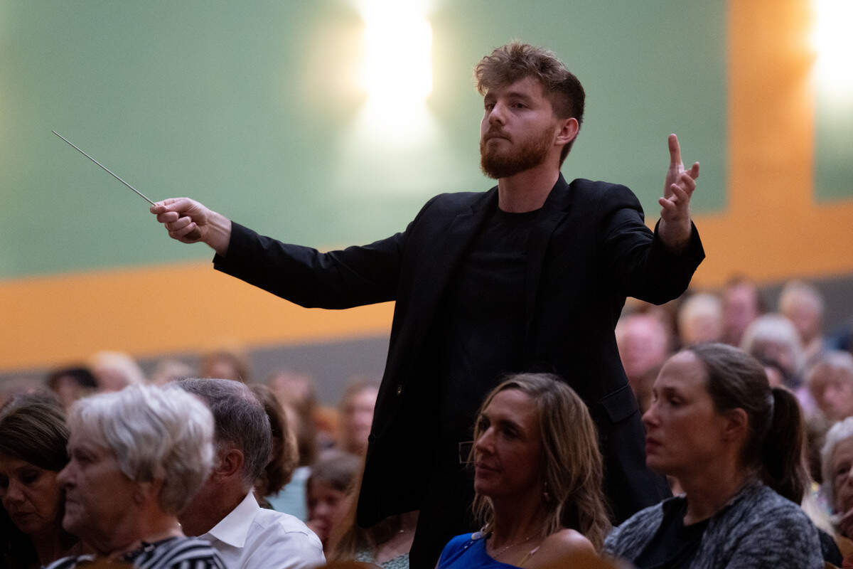 A conductor for the Biloxi Civic Orchestra conducts the band during a grand opening celebration at the Saenger Theatre in Biloxi on Saturday, June 6, 2026.