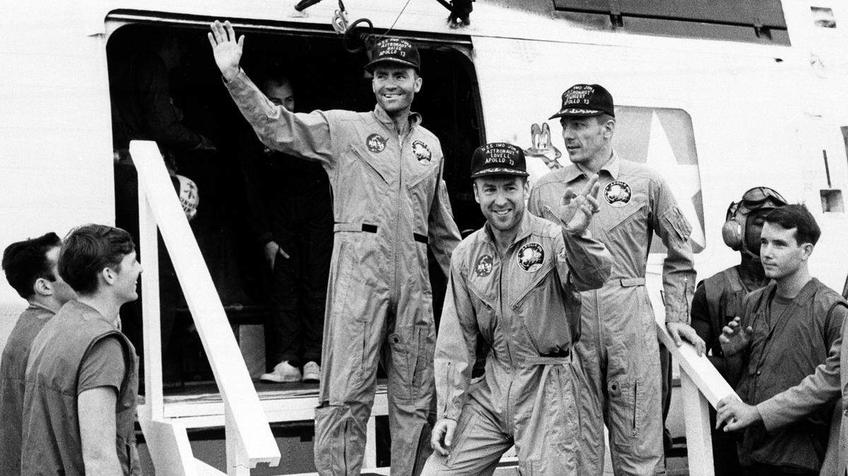 Apollo 13 astronaut and Biloxi native Fred Haise waves as he and fellow astronauts James Lovell (center) and John Swigert leave a helicopter to step aboard carrier Iwo Jima in the Pacific ocean after their successful recovery on Friday, April 17, 1970. 