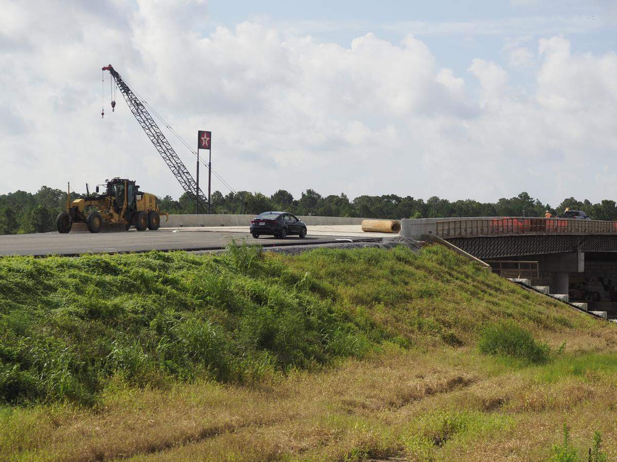 A T. L. Wallace employee’s car sits at the edge of the new new Menge Avenue five-lane deck at exit 24 of I-10, where the new Buc-ee’s is under construction. A final layer of asphalt is required to finish the approach. The new bridge and redesign of the exit are needed to handle the additional traffic the travel center will bring to that area.
