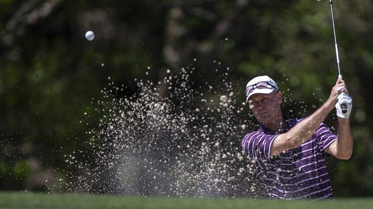 Bob Estes chips out of the sand during the Rapiscan Systems Classic at Grand Bear Golf Club in Saucier on Thursday, March 31, 2022.