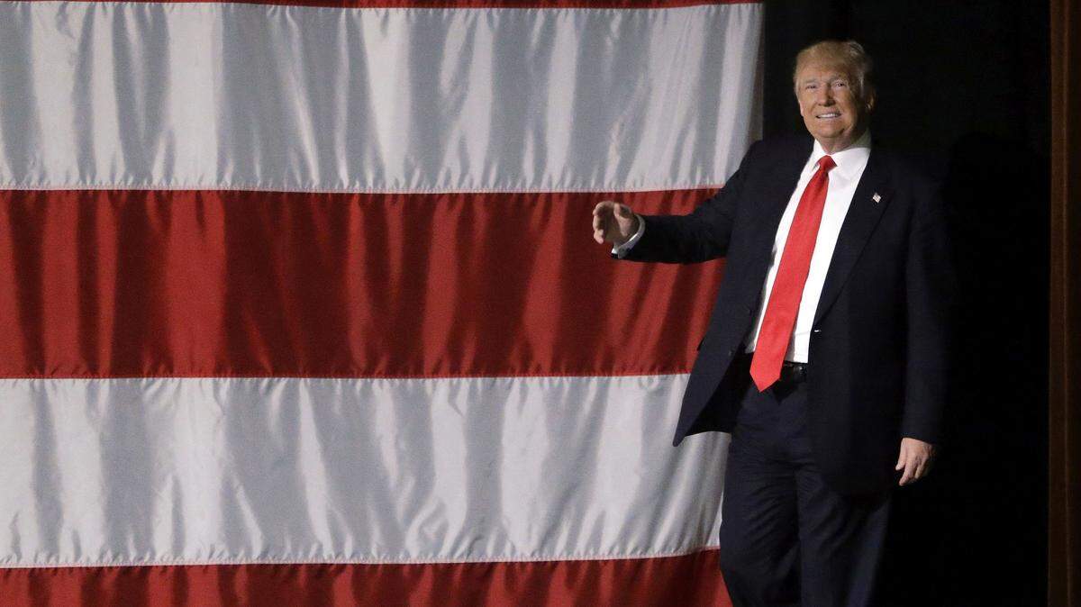 Republican presidential candidate Donald Trump walks on stage before speaking during a campaign rally at the Indiana Theater Sunday, May 1, 2016, in Terre Haute, IN. (AP Photo/Seth Perlman)
