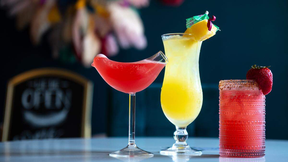 The Shake Ya Tail Feather, left, the Fire Bird Margarita, right, and the Bird of Paradise, three speciality cocktails at the Hen House, which serves drinks and small bites, in Bay St. Louis on Wednesday, May 29, 2024.