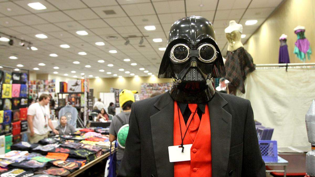 TIM ISBELL/SUN HERALD 
 Josh Roberson goes as steampunk Darth Vader as he looks at the various merchandise for sale at Geekonomicon, Saturday, Dec. 11, 2015.