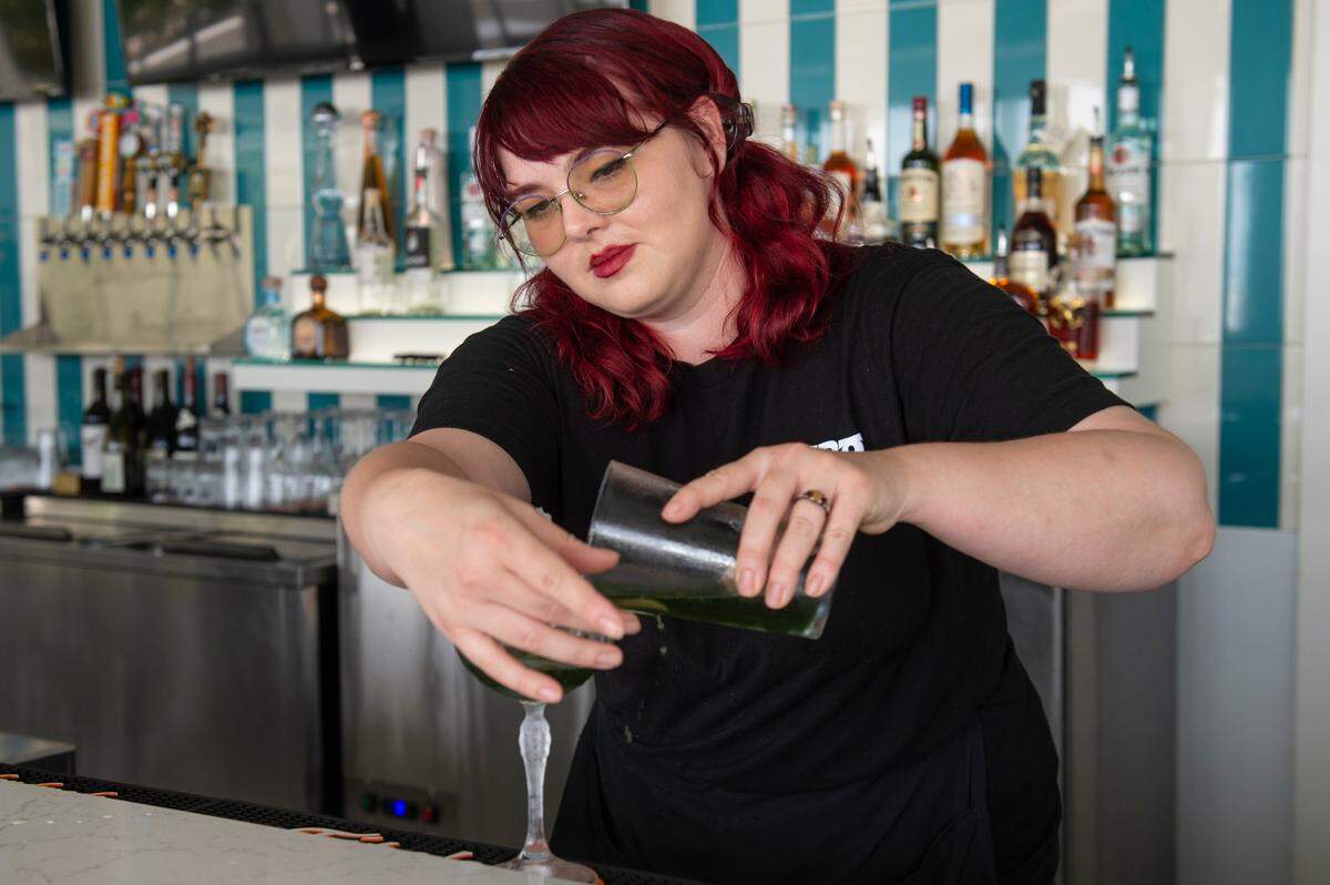 Bartender Kelsi Dunkelbarger prepares a Pandan Daiquiri, a cocktail consisting of rum, pandan syrup and lime, at Toro Sushi and Sake in Bay St. Louis on Wednesday, Aug. 28, 2024.
