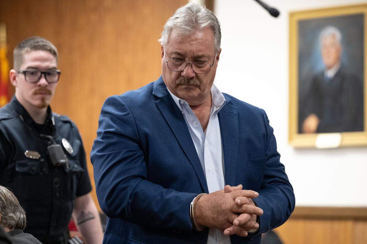 A handcuffed Philip Moran appears in court during a hearing at Harrison County Circuit Court on Wednesday, Jan. 28, 2026.