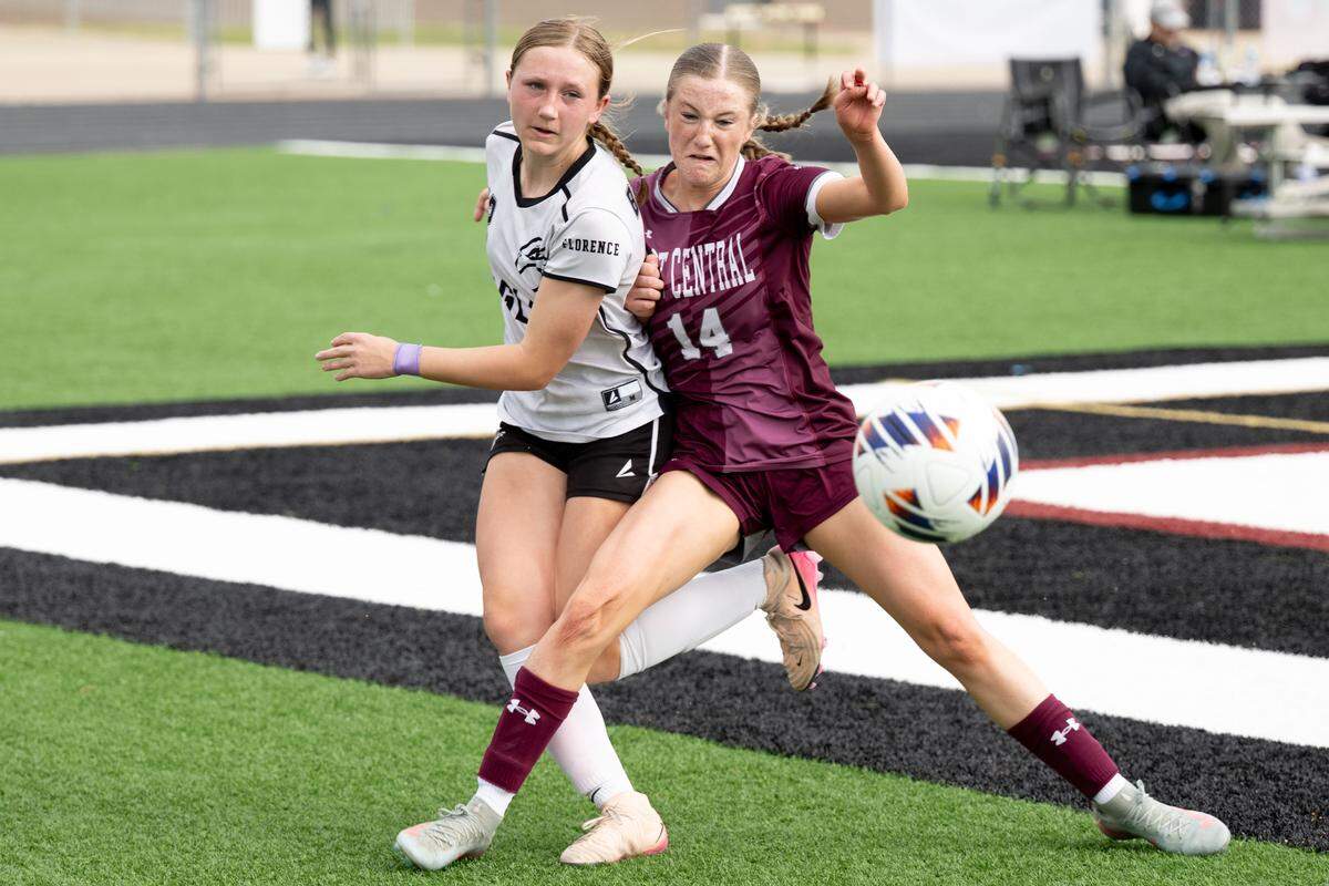 East Central's Lucy Myrick (14) knocks the ball away from Florence's Brooke Bridges (12) during the h5A girls soccer state championship game on Feb. 20, 2026.