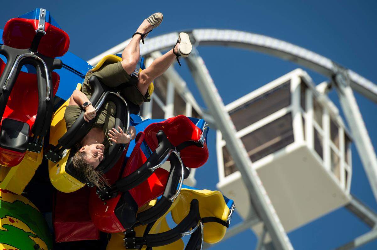 Wendi Barrett, of Biloxi, rides the Storm Surge ride during the grand opening of Paradise Pier amusement park at Margaritaville in Biloxi on Friday, March 3, 2023.