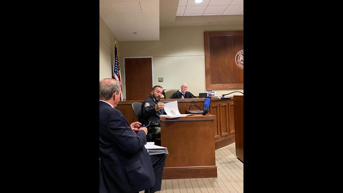 Harrison County prosecuting attorney, Herman Cox, seated far left, looks as Gulfport Police Detective, Justin Clifton, reviews his notes during a preliminary hearing in the first-degree murder case of Jerri Lynn Roby before Justice Court Judge Albert Fountain in February.