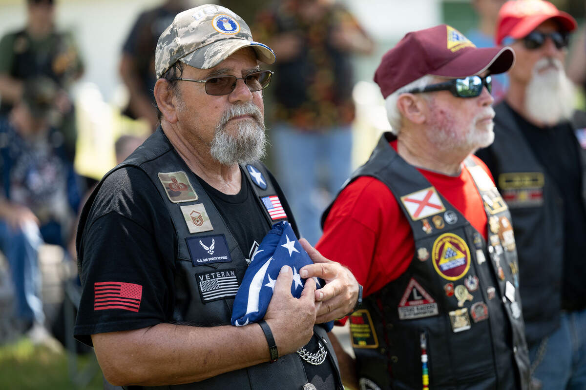 Steve Carrington holds a folded American flag during a ceremony at Biloxi National Cemetery on Saturday, July 11, 2026.