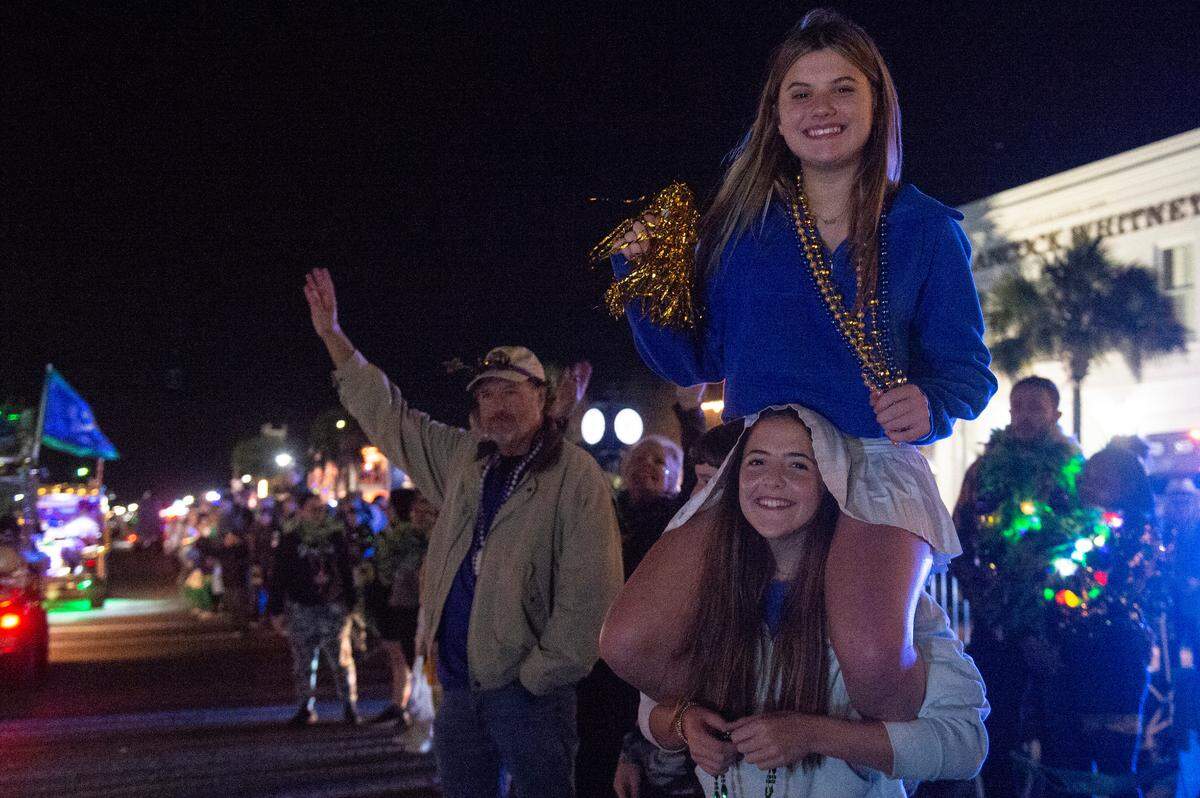Kids cheer for beads during Mystic Krewe of the Seahorse’s Lundi Gras parade in Bay St. Louis on Monday, March 3, 2025.