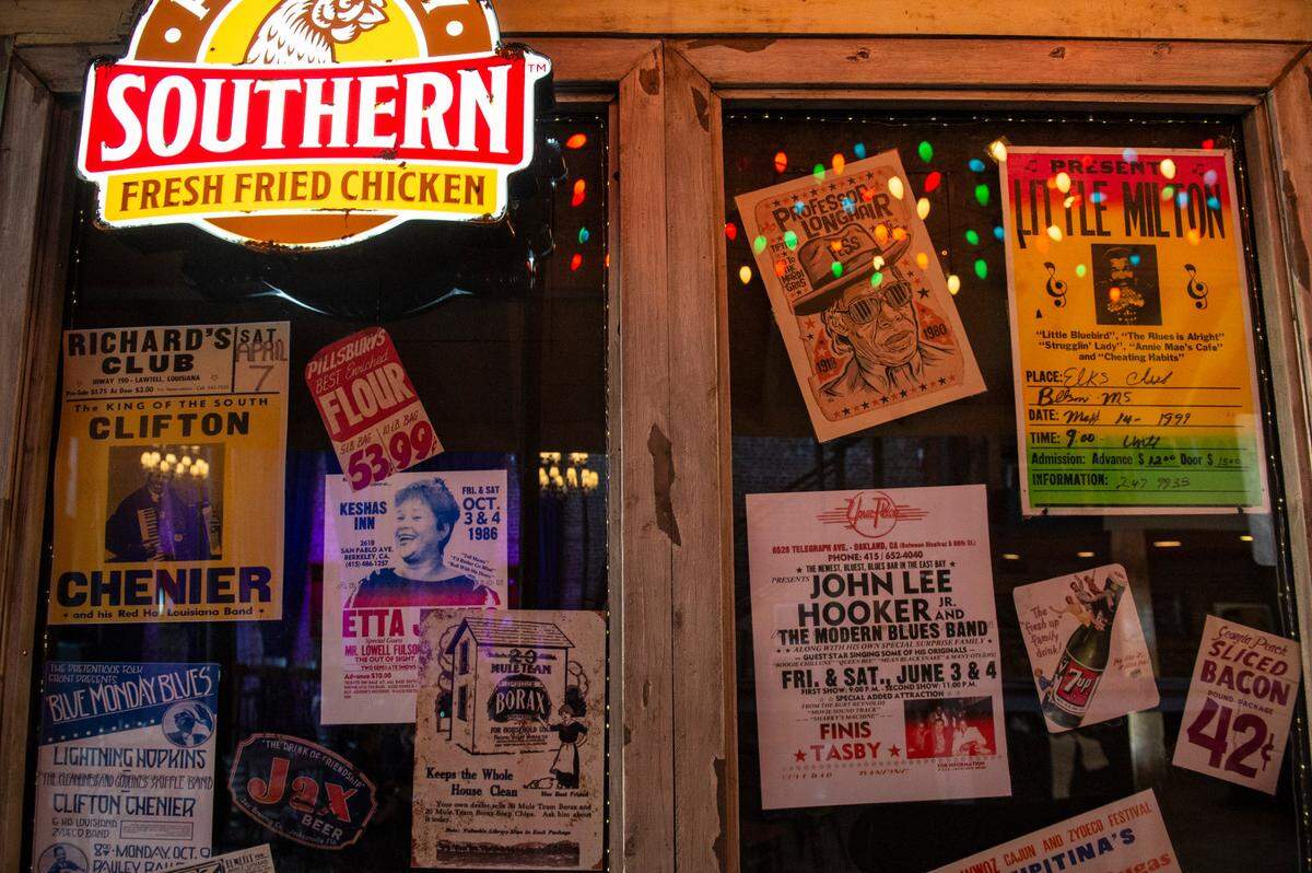 Old concert posters line the walls of a porch area inside the new Ground Zero Blues Club in Biloxi intended to mimic the original Ground Zero in Clarksdale.