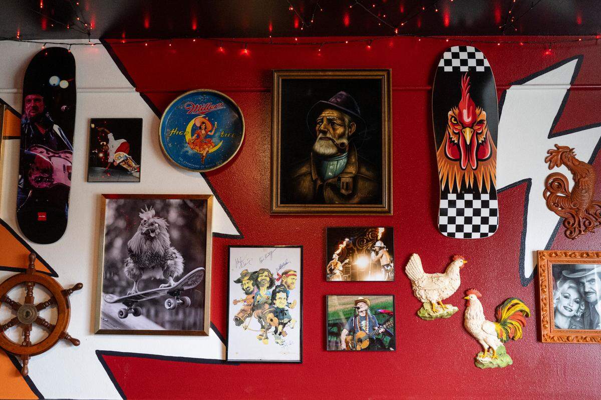 Chicken themed art decorates the walls at Rip ’N Hot Chicken in Biloxi.