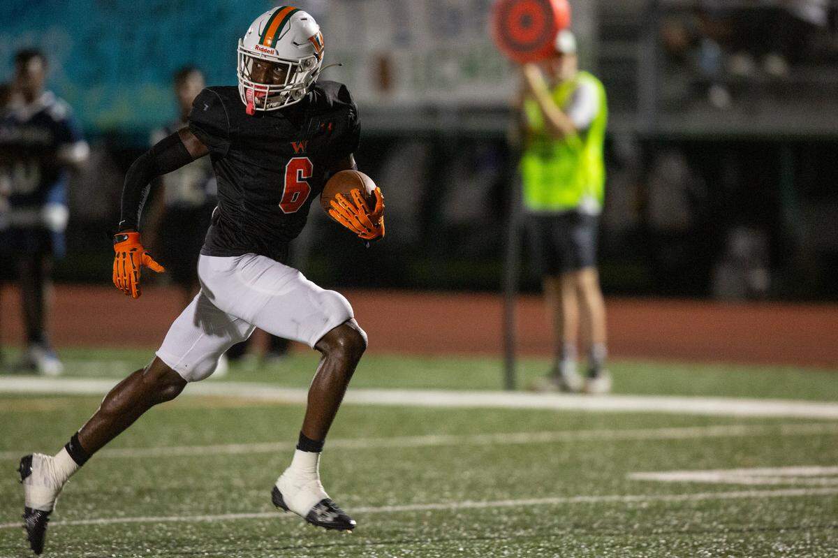 West Harrison Hurricanes’ Jahmad McGowan runs the ball for a touchdown during a game against Moss Point at West Harrison High School in Gulfport on Friday, Sept. 22, 2023.