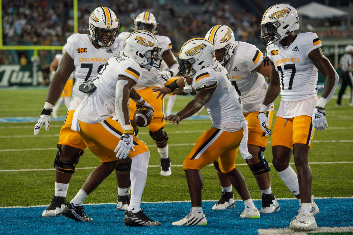 Southern Miss players celebrate after a touchdown against Tulane at Yulman Stadium in New Orleans on Saturday, Sept. 24, 2022.