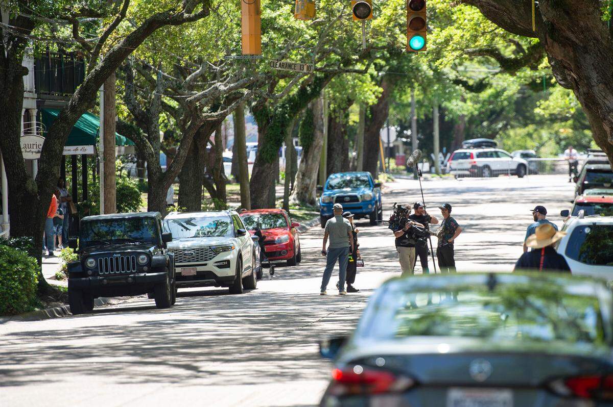 The cast and crew of Cash Out 3 stand in the middle of Washington Avenue during filming in Ocean Springs on Tuesday, April 8, 2025.