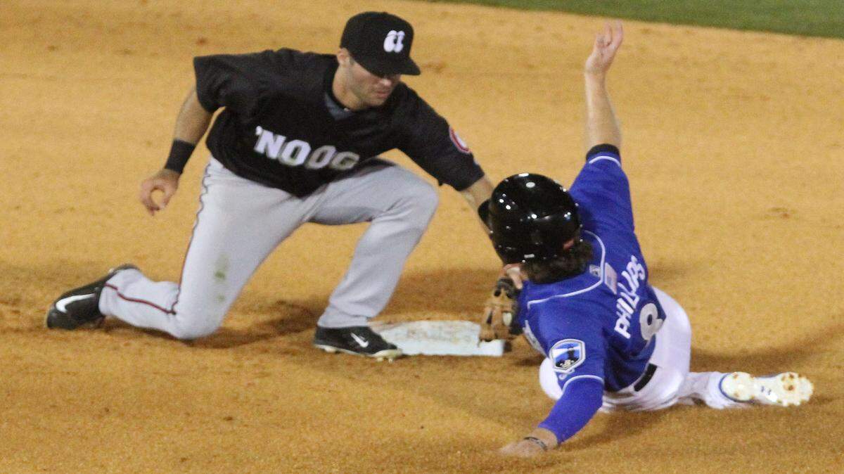 JOHN FITZHUGH/SUN HERALDChattanooga shortstop Levi Michael tags out Biloxi Shuckers' Brent Phillips during the fifth inning of their game at MGM Park in Biloxi on Thursday April 7, 2016.