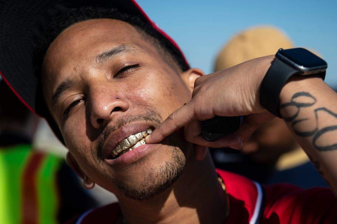 Trey Calloway, of Crestview, Florida, shows off his grill during Black Spring Break in Biloxi on Saturday, April 9, 2022.