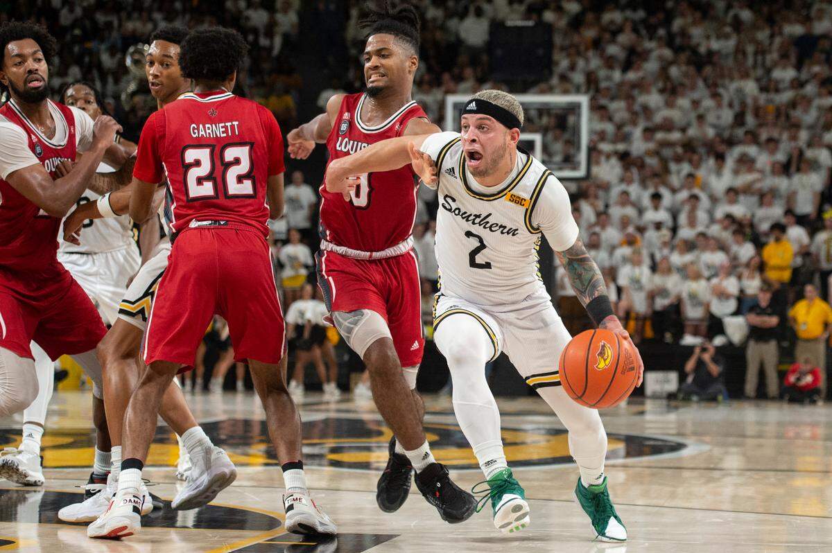 Southern Miss’s Neftali Alvarez fights for the ball during a game against Louisiana-Lafayette at Reed Green Coliseum on Thursday, Feb. 9, 2023.