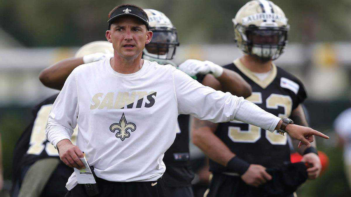 New Orleans Saints defensive coordinator Dennis Allen instructs players during drills at NFL football practice in Metairie, La., Thursday, May 26, 2016. (AP Photo/Gerald Herbert)