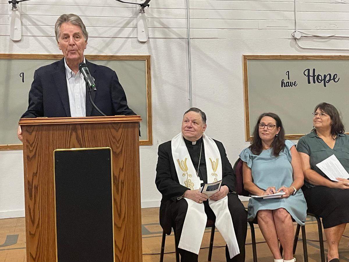 Biloxi Mayor Andrew ‘Fofo’ Gilich throws his support behind the Mercy Cross Center that opened Tuesday in Biloxi to serve the homeless population. Seated beside him are, from left, Bishop Louis F. Kihneman III; Jennifer Williams, diocesan director of Catholic Social Services of South Mississippi; and center director Pam Leach.