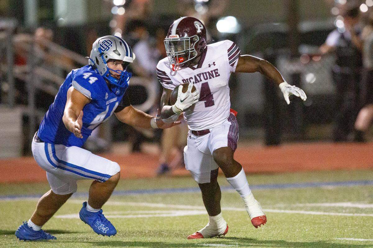 Picayune’s Darrell Smith runs the ball during a game between Picayune and Ocean Springs at Greyhound Stadium in Ocean Springs on Friday, Sept. 27, 2024.