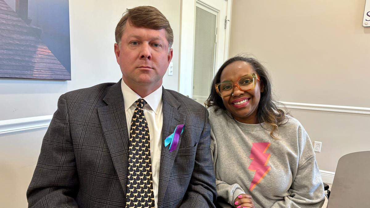 Kameca Locks of Gulfport, right, sits with one of her attorneys, Matthew Quinlivan of Gulfport. Locks contends in a lawsuit that she was wrongly jailed for 25 days after State Farm Fire & Casualty Co. put her auto policy under the wrong name and she was indicted in 2021 in Tennessee for identity theft. The charge was eventually dismissed and expunged.
