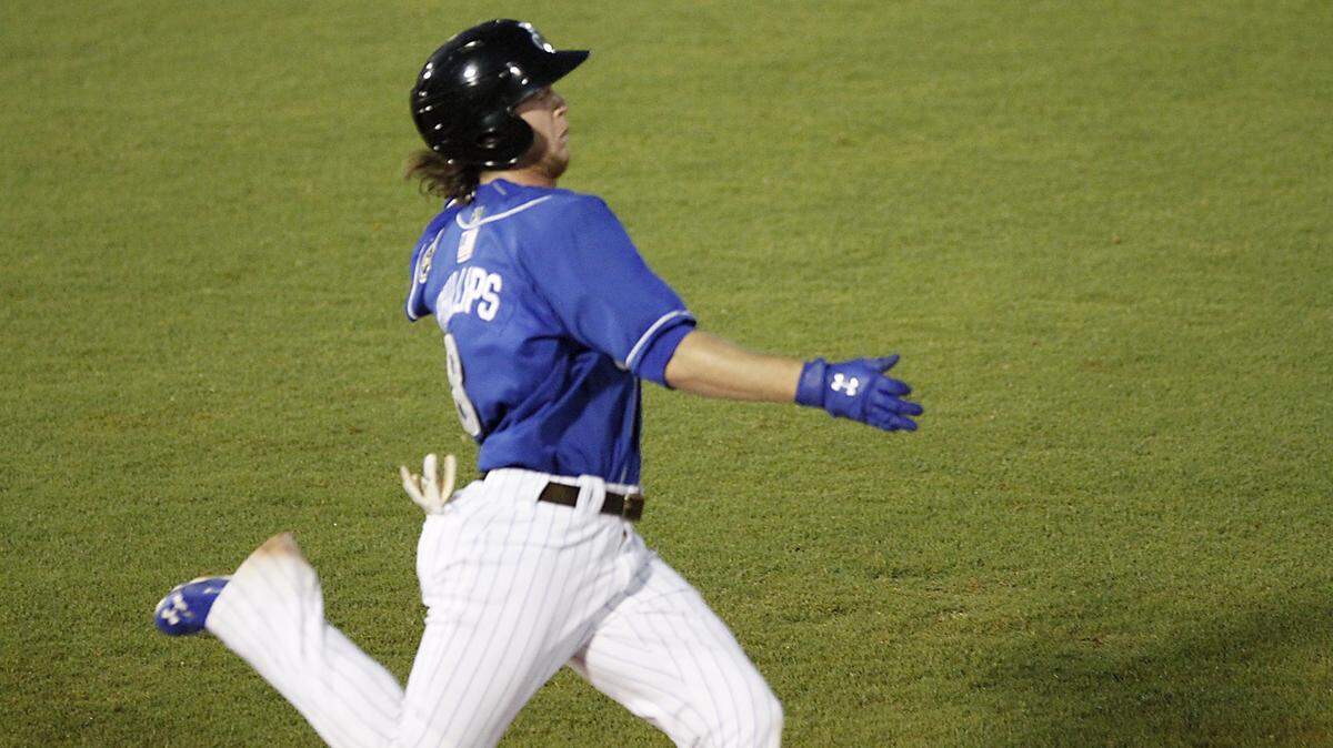 TIM ISBELL/SUN HERALD 
 Biloxi's Brett Phillips sprints to first base to load the bases against Birmingham, Monday, June 13, 2006.