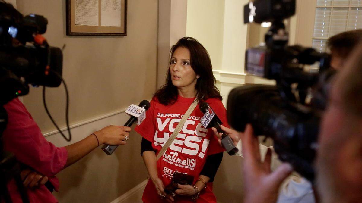 AMANDA McCOY/SUN HERALD 
 Romy Simpson, one of the co-owners for Fun Time USA amusement park, talks to the media after the property owners of the proposed site for the park withdrew their rezoning request for a portion of the property at a Gulfport City Council meeting on Tuesday, March 22, 2016. Simpson said they will move ahead with plans to rebuild the amusement park.