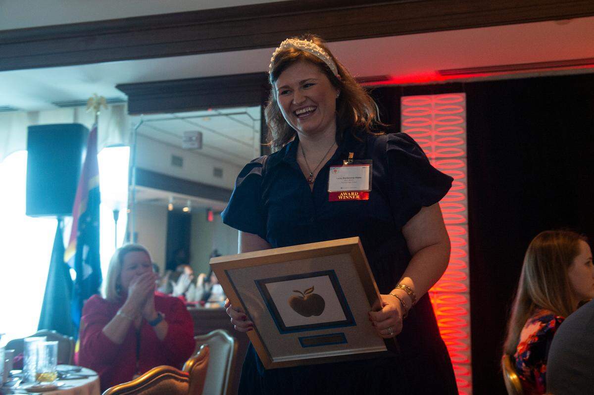 Grant winner Lacey Vitalec reacts as she receives her honor during the 2024 Leo W. Seal Innovative Teacher Grants Awards Luncheon at the Great Southern Club in Gulfport on Friday, Jan. 26, 2024. Vitalec’s project “Watch Out for Watersheds” will allow her students to get updated resources to study watersheds.