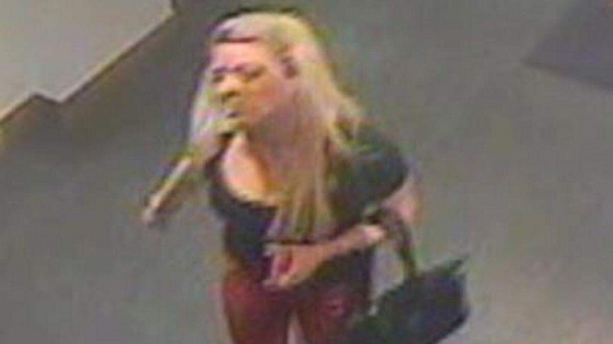 COURTESY OF BILOXI POLICE 
 Surveillance cameras capture a photo of a woman accused of stealing a large amount of cash from a hotel room at an area casino on Nov. 30.
