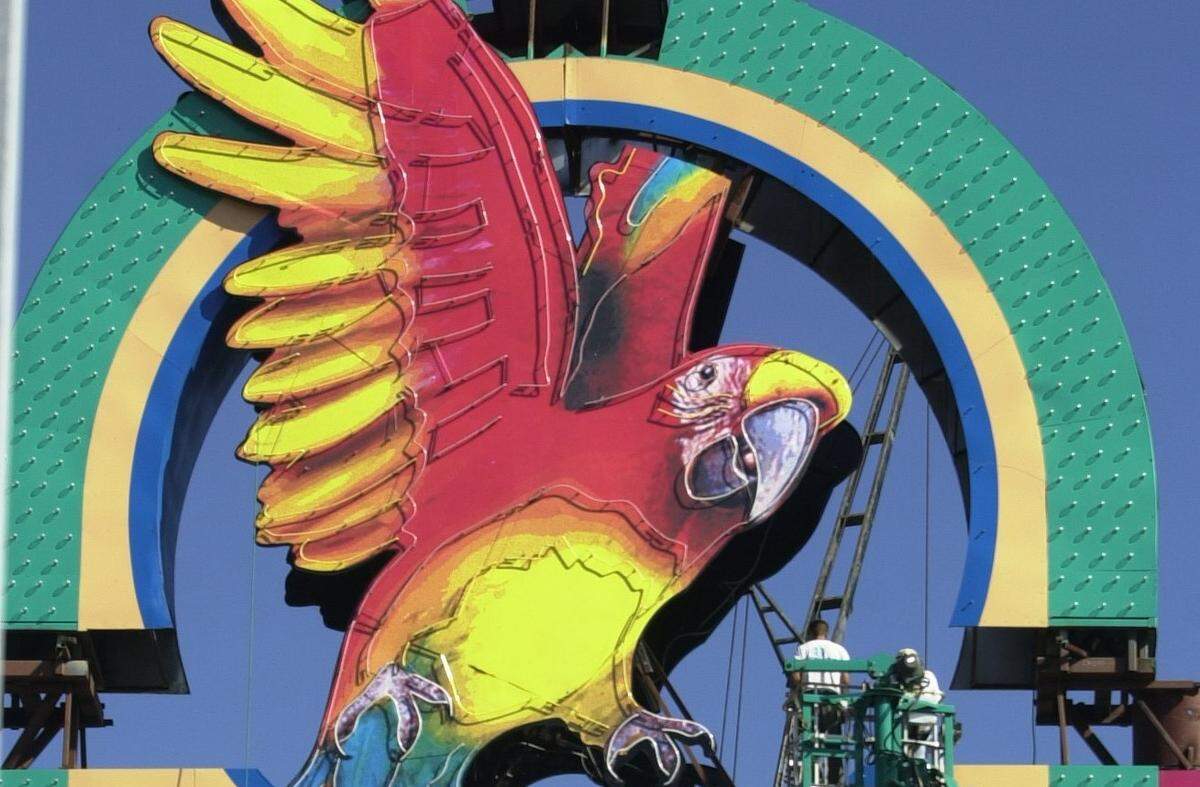 Workers for Signlite Sign co., from Slidell, La, install parts of a new, 110’ sign for the Isle of Capri Casino in Biloxi on Wednesday. The new sign will replace the existing 74’ sign, which at one time was one of the tallest on the coast.