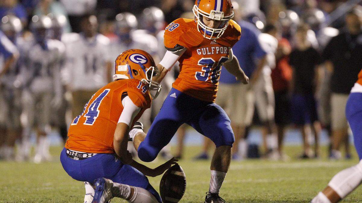 TIM ISBELL/SUN HERALD 
 With Rhodes Walker (14) holding, kicker Cain Suddith booted four field goals in Gulfport's 24-7 win over then-No. 1 Ocean Springs on Friday at Milner Stadium. Prior to the game, Suddith had converted just 1 of 3 attempts on the season.