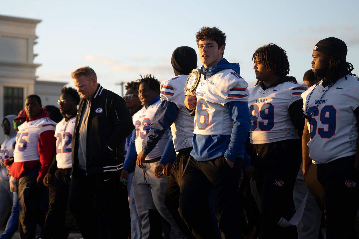 Gulfport players walk down 22nd Avenue during the Champions Christmas Parade on Monday, Dec. 8, 2025.
