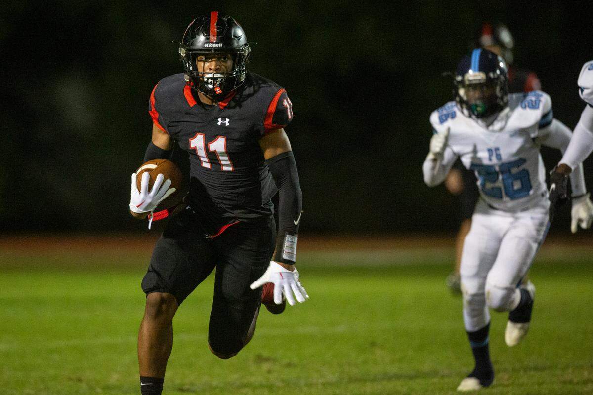 St. Stanislaus’ Chandler Chapman runs the ball during a playoff game against Port Gibson at St. Stanislaus in Bay St. Louis on Friday, Nov. 4, 2022.