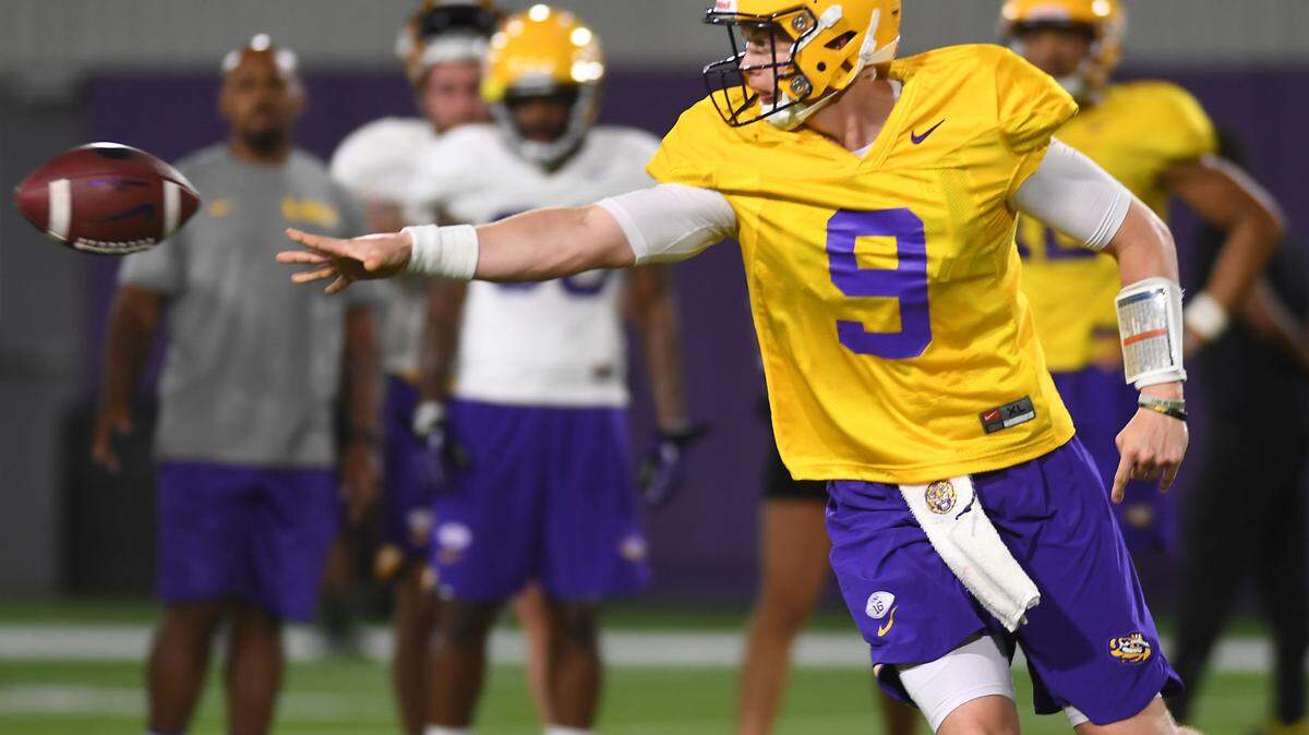 LSU quarterback Joe Burrow pitches the ball during drills at an LSU football practice on Monday. Burrow has been named the starter against Miami on Sunday.